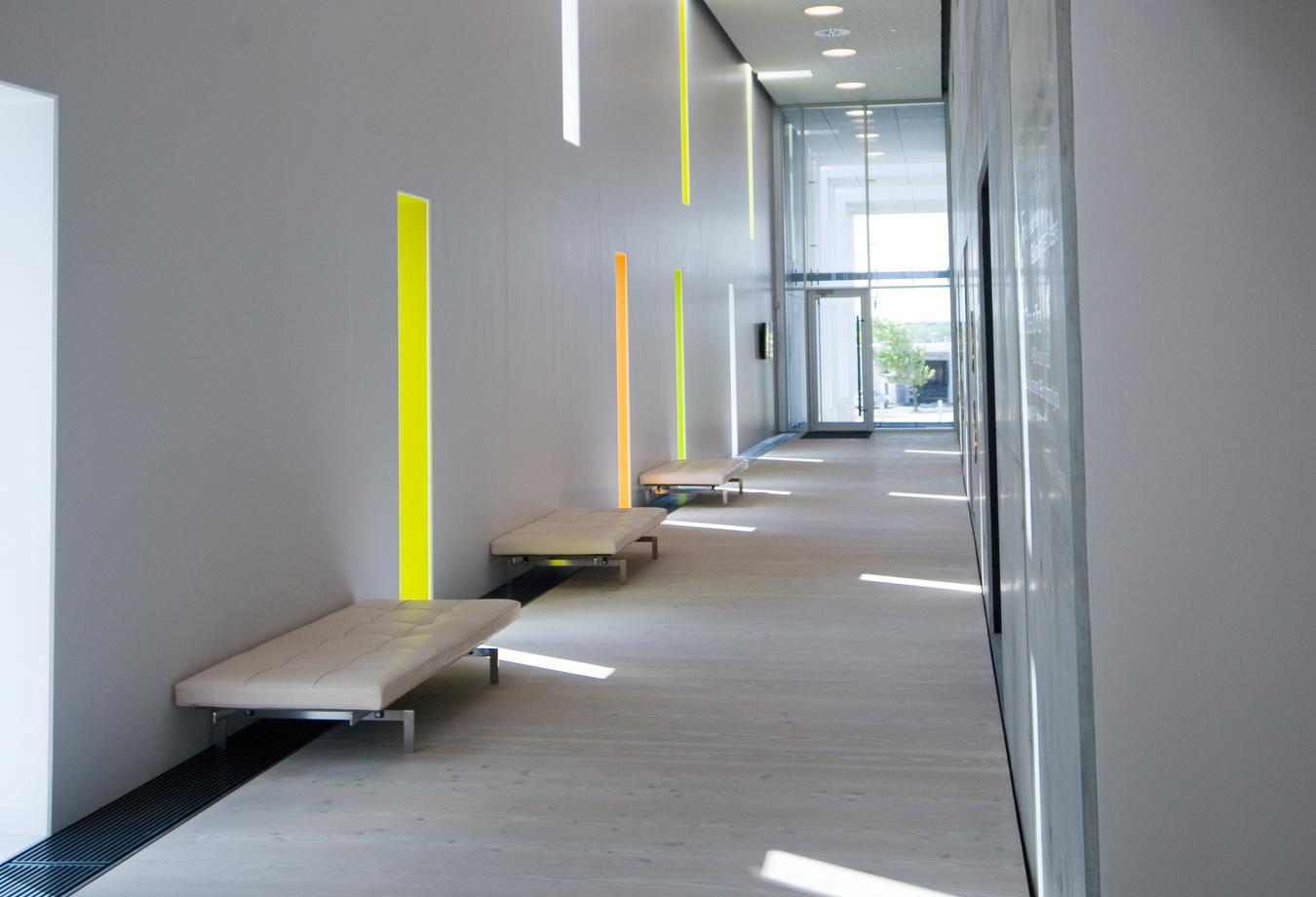 Hallway with narrow light inlets that form a pattern. Photo